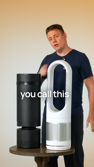 A man comparing Heatbit Maxi device and Dyson product
