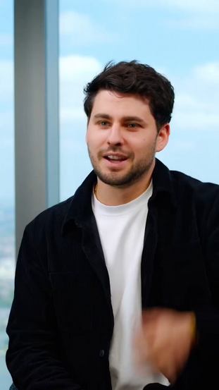 A Man in a black jacket and white shirt discussing refunds from bitcoin heaters