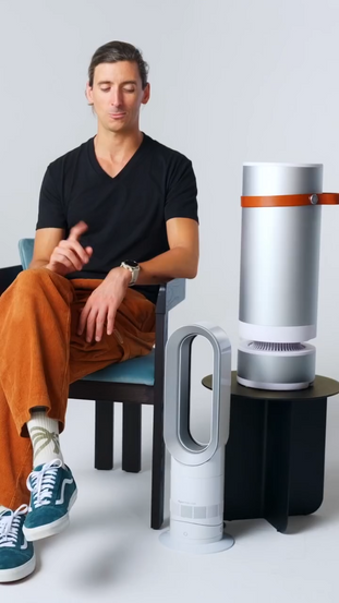A man sitting next to Heabit and Dyson products explaining how you can use Heatbit heater
