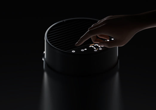 A hand interacting with Maxi Pro digital display