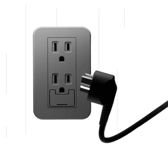 Gray wall outlet with a black plug on a light gray background
