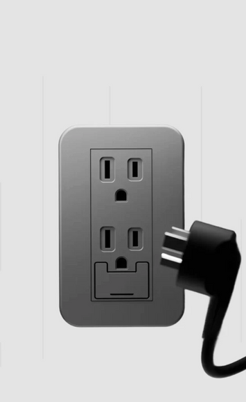 Gray wall outlet with a black plug on a light gray background